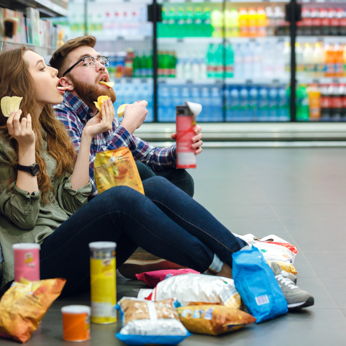 Couple eating junk food